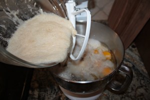 Add the yeast and then melted coconut oil (this keeps the coconut oil from hardening back up).